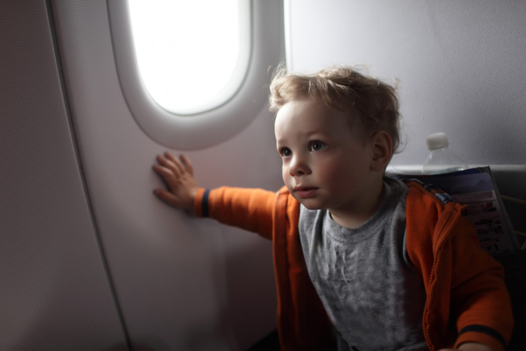 Toddler in seat on a plane