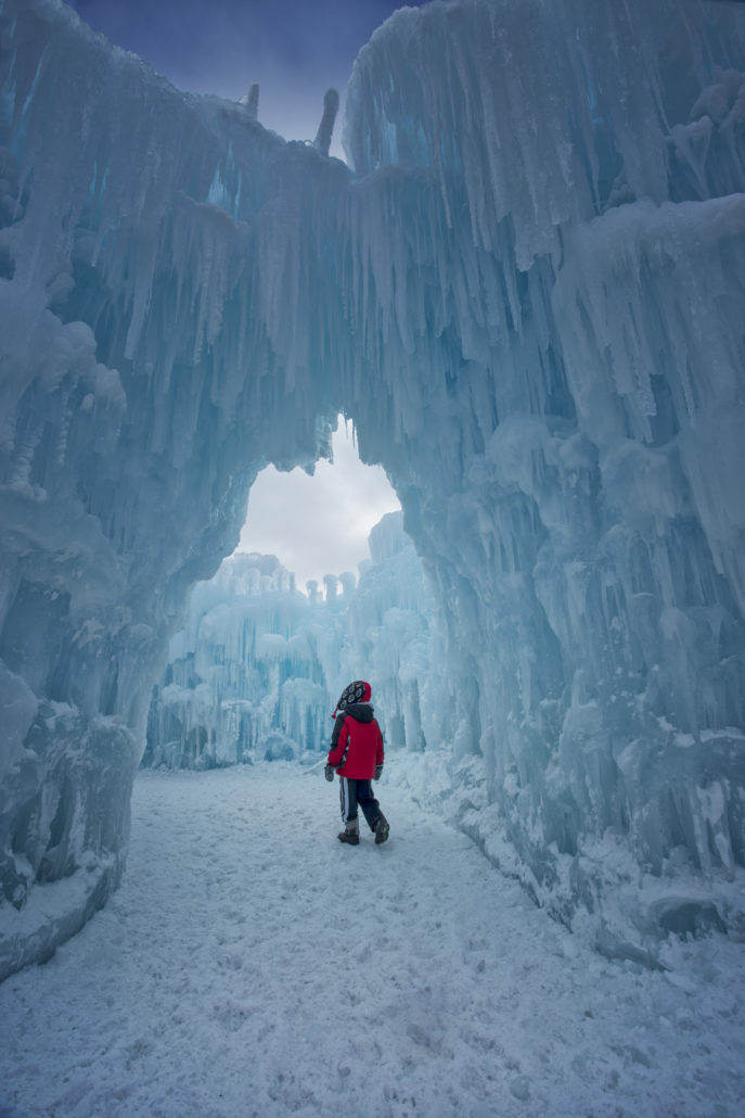 kid walking through Ice Castle