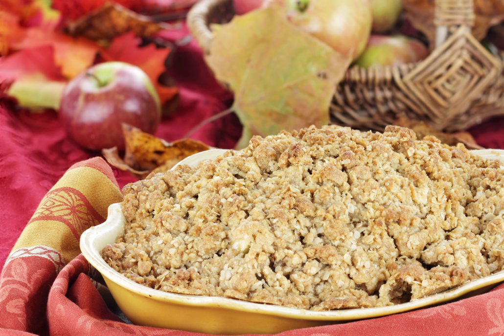 Freshly baked apple crisp with fresh apples and autumn