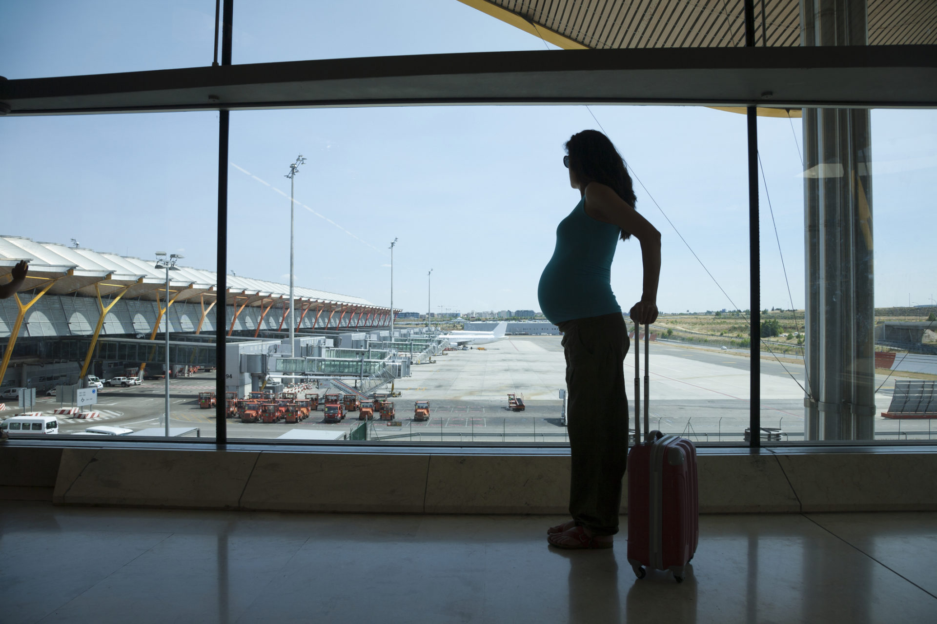 pregnant woman travel on a plane