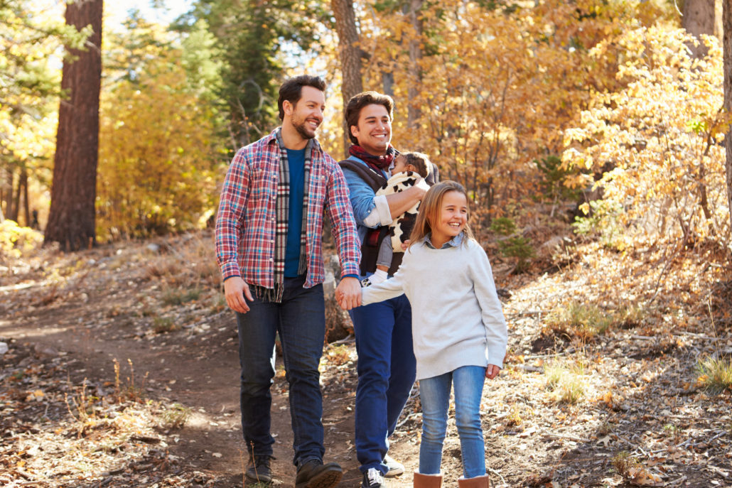 family hiking in fall with baby