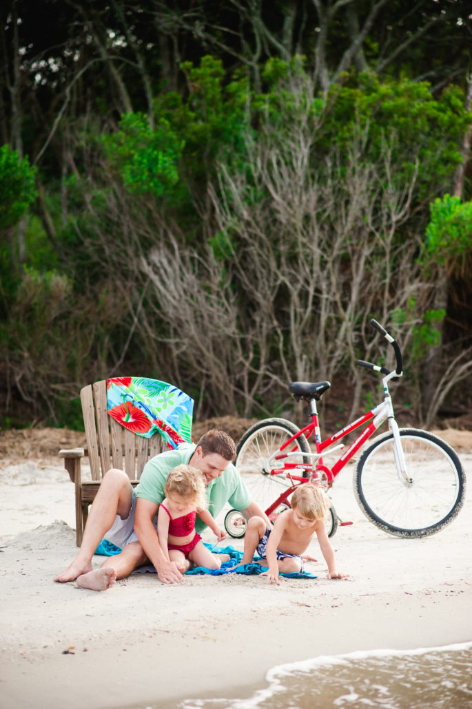 family with bikes on beach