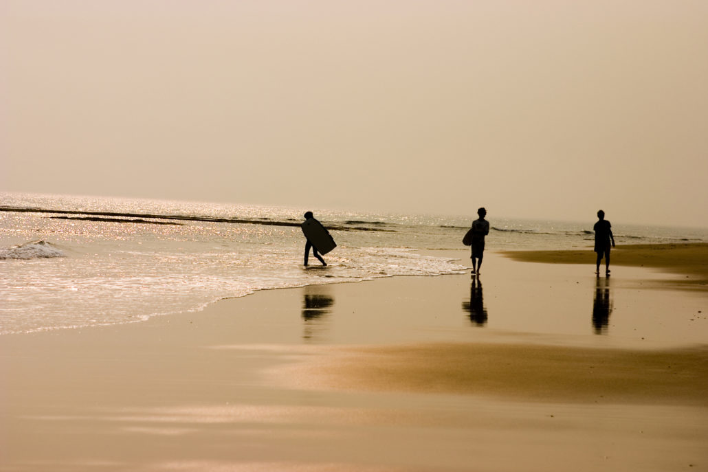 kids surfing on the beach