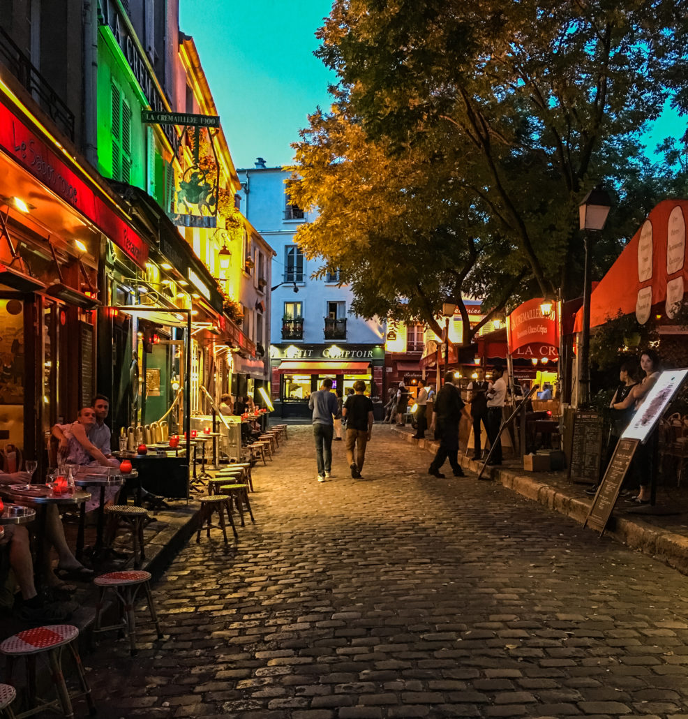 Nighttime on a busy Montmartre street on the Place du Tertre, Paris, France