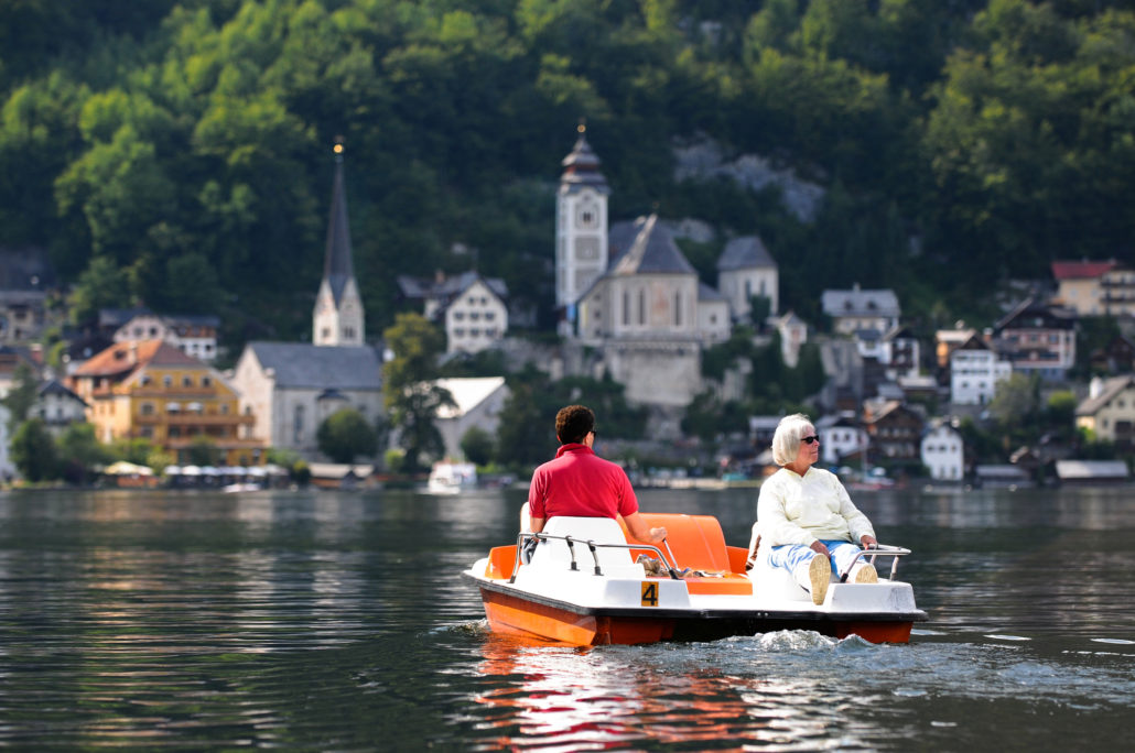 Tourists on pedal boat at Hallstatt, Austria