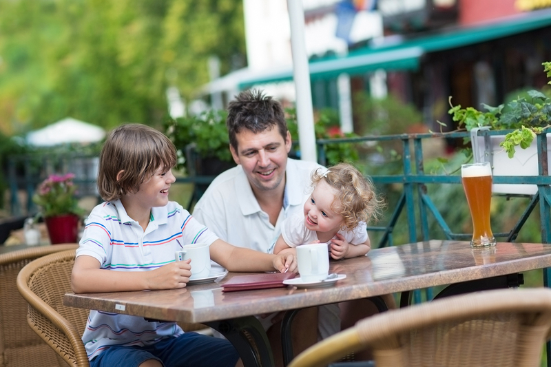 Family in Europe with coffee © Famveldman | Dreamstime.com