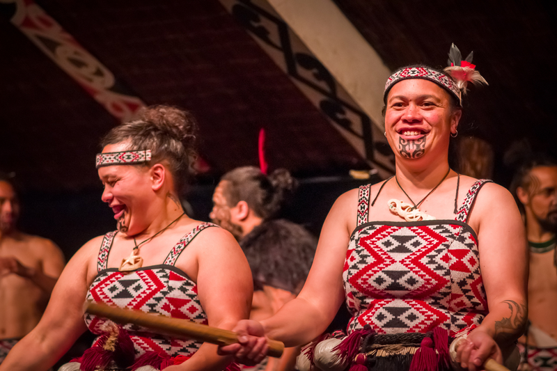 Dancers of the Maori Culture village holding a wooden sticks in Tamaki Cultural Village, Rotorua, New Zealand © Pablo Hidalgo | Dreamstime.com