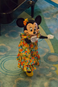 Minnie Mouse waves during a meet in the attrium of the Disney Magic. 