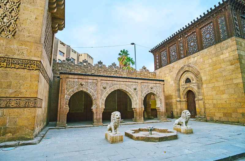 The stone fountain with lions at the beautiful carved pavilion of the Manial Palace mosque, Cairo, Egypt.