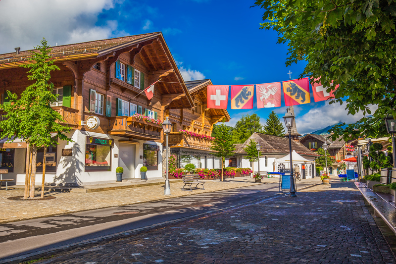Old city center of Gstaad town, famous ski resort in canton Bern, Switzerland.